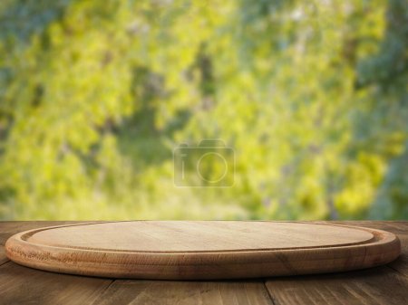 Photo for Round wooden cutting board, nature - Royalty Free Image