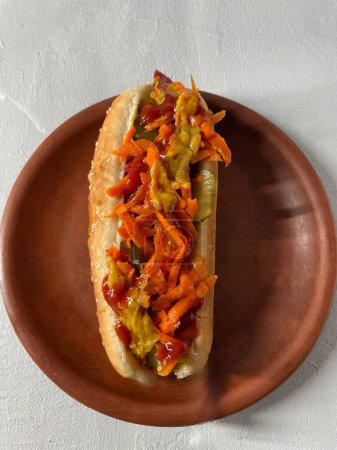 Photo for Savory Hot Dog with Carrot Toppings. - Royalty Free Image