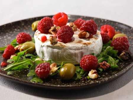 Photo for Grilled Camembert with Raspberry Garnish, Closeup Shot - Royalty Free Image