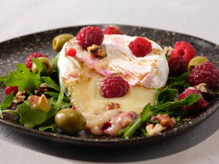 Photo for Grilled Camembert with Raspberry Garnish, Closeup Shot - Royalty Free Image