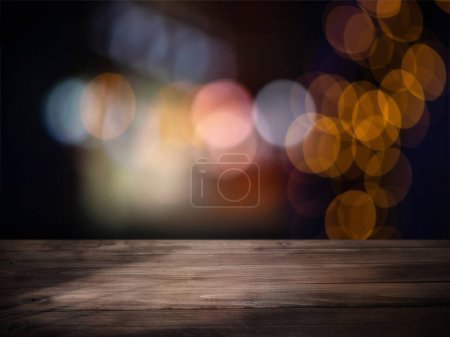 Photo for Wooden table surface with background bokeh lights - Royalty Free Image