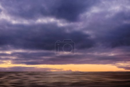 Photo for Empty Wooden Tabletop Against Dramatic Twilight Sky - Royalty Free Image