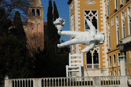 Photo for Astronaut In The Horizontal Position At Venetian Renaissance Style Palazzo Franchetti On The Canale Grande In Venice Italy On A Wonderful Spring Day With A Clear Blue Sky - Royalty Free Image