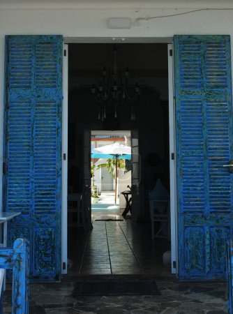 Blue Shutters At The Entrance Of A Cafe In Cala Rajada Mallorca On A Wonderful Sunny Spring Day