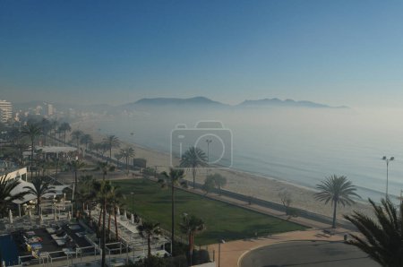 Fog In The Morning On The Beach Of Cala Millor Mallorca On A Wonderful Sunny Spring Day With A Clear Blue Sky