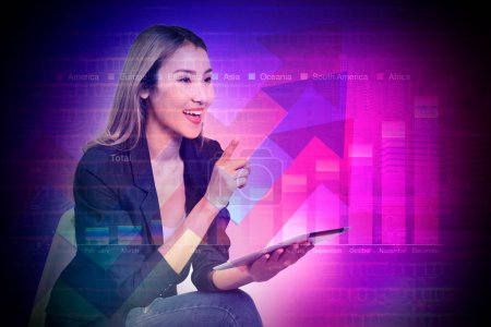 Photo for Businesswoman in black suit holding digital tablet sit in chair explaining earnings and continuous growth business against colorful background of annual earnings graph. - Royalty Free Image
