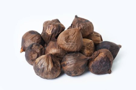 Photo for Heaps of black garlic as healthy food isolated on white background. - Royalty Free Image