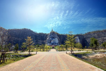 Photo for Wide-angle photo shows the beautiful scenery around the area where big stone carving Buddha statue is housed. - Royalty Free Image