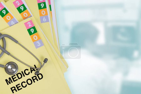 Photo for Medical record folder with blur photo of working doctor in background. - Royalty Free Image