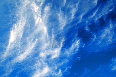 Photo for White clouds float past like ripples in blue sky. Movement of clouds in nature. - Royalty Free Image