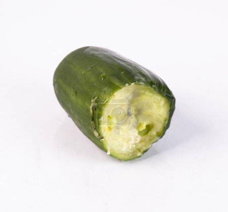 rotting cucumber in close-up on a white background.