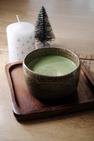 Photo for Hot matcha green tea on wooden table - Royalty Free Image