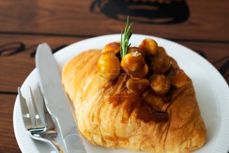 Photo for Macadamia croissants on a wooden table - Royalty Free Image
