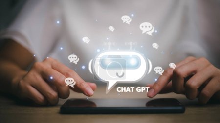 Foto de ChatGPT Chat with AI or Artificial Intelligence. woman chatting with a smart AI or artificial intelligence using an artificial intelligence chatbot developed by OpenAI. - Imagen libre de derechos