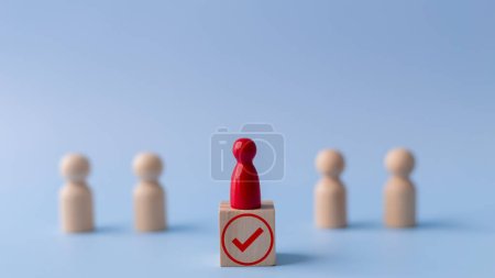 Business hiring and recruitment selection. Career opportunity. Human Resource Management. red human icon standing on a checkmark. Choice of employee leader from the crowd.