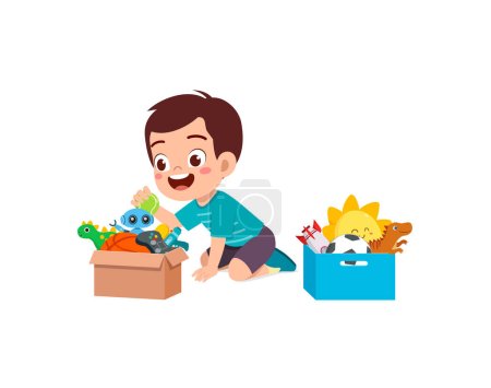 niño pequeño poner juguetes a la caja para la donación