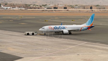 Photo for Muscat, oman- November 21,2023: flydubai airplane getting ready to take off from muscat international airport - Royalty Free Image
