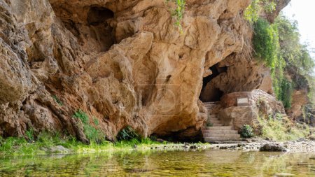 Photo for Ain Garziz Spring, a well-known fresh-water spring and picnic spot close to Salalah. There are several caves at the site as well. - Royalty Free Image