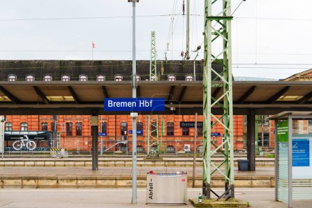 Photo for Busy morning at Bremen Central Railway Station as passengers wait for their trains on the platforms, with modern architecture and clear signage visible in the background. - Royalty Free Image