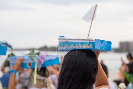 Téléchargez les photos : Boat with offerings to iemanja, during a party at copacabana beach. - en image libre de droit