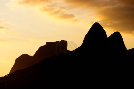 silhouette of Two Brother Hill and Gavea Stone in Rio de Janeiro, Brazil.