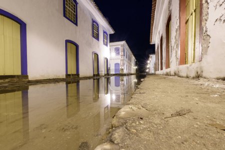 Streets of Paraty with high tide at night in Rio de Janeiro, Brazil.