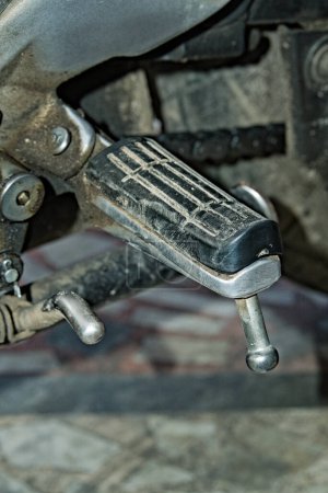 close up photo of footrest in a motorbike