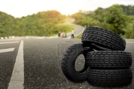 Photo for Black rubber tyre set with curve on the hill is background.Safe travel ideas with the best tires - Royalty Free Image