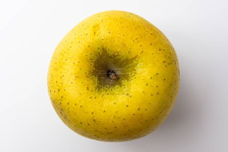 Foto de Manzanas doradas sobre un fondo blanco - Imagen libre de derechos