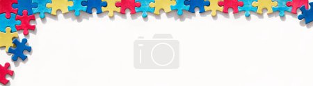 Photo for Puzzle pieces, mosaics. Panoramic banner for Autism Awareness Day, World Autism Day. Banner, panorama, background for flyer, poster edge, corner design element. Health Care Awareness campaign. - Royalty Free Image