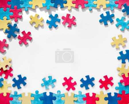 Photo for Autism Awareness Day, World Autism Day, rectangular frame with puzzle pieces around, copy-space. Design element or background for flyer, poster for Health Care Awareness campaign for Autism - Royalty Free Image