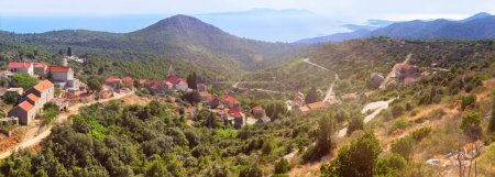 Photo for Velo Grablje, historic village on Hvar island in Croatia famous for lavender, vine and olive oil production. Panoramic banner image. Panorama, eerial view from mountain road. Bird view on old houses. - Royalty Free Image