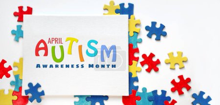 Photo for Text, caption World Autism Awareness Day, April 2 written on canvas with puzzle pieces. Design of flyer, poster for Health Care Awareness campaign for Autistic disorder. - Royalty Free Image