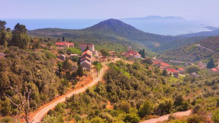 Photo for Velo Grablje, historic village on Hvar island in Croatia famous for lavender, vine and olive oil production. Aerial view from an old mountain road. Bird view on old stone houses. - Royalty Free Image