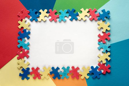 Photo for Autism Awareness Day, World Autism Day, rectangular frame with puzzle pieces, copy-space. Design element or background for flyer, poster for Health Care Awareness campaign for Autism - Royalty Free Image