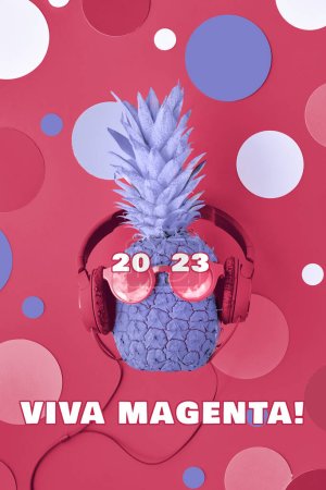 Photo for Viva Magenta color of the year 2023. Funny pineapple painted purple on magenta background with various disco circles. Pineapple character in sunglasses and earphones. - Royalty Free Image