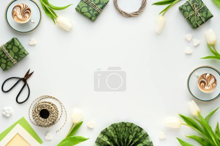 Photo for White tulip flowers, coffee cups and gift boxes.Off white background with green wrapping paper, scissors and checkered cord. Flat lay, top view overhead with copy-space, place for text. - Royalty Free Image