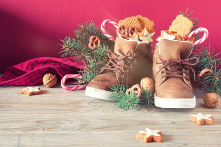 Photo for Saint Nicholas Day or Nikolaus, german holiday, December 6. Children shoes with traditional sweets. - Royalty Free Image