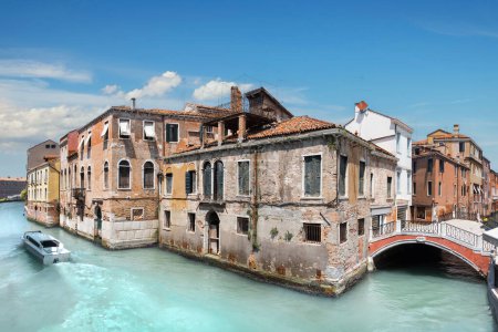 Photo for Old house and a bridge in central Venice in Italy on a bright day. - Royalty Free Image