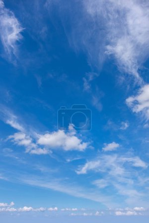 Photo for Sky with fluffy white clouds filling the blue expanse. - Royalty Free Image