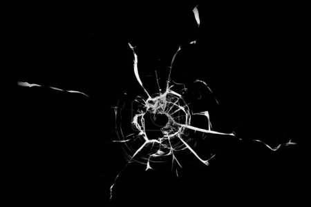 Photo for Broken hole in glass black background. - Royalty Free Image