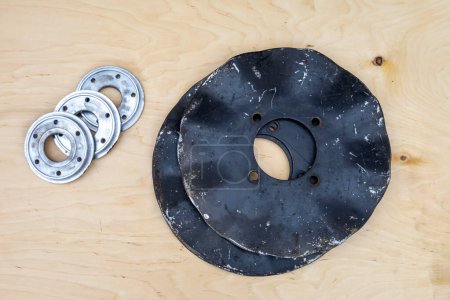 Discs and bearings for a tractor cultivator.