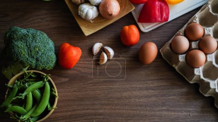 Photo for Flay lay food cooking vegetable broccoli egg pepper pea garlic background on wood texture text copy space - Royalty Free Image