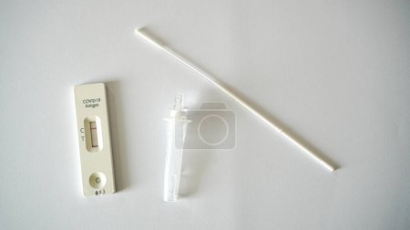 Photo for Covid 19 antigen rapid test kit showing positive result medical tool - Royalty Free Image