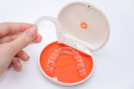 Photo for Sydney, Australia, 2022-10-19 Invisalign Vivera retainers in a box. Ortodontic clear retainers used to protect the results of Invisalign bracers treatment. - Royalty Free Image