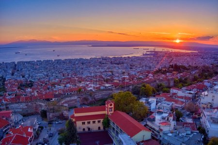 Photo for Aerial drone view of old Byzantine castle and the famous city of Thessaloniki or Salonica at sunset, North Greece - Royalty Free Image