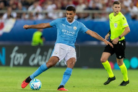 Photo for Athens, Greece - August 16,2023: Player of Manchester City Rodrigo in action during the UEFA Super Cup Final match between Manchester City and Sevilla at Stadio Karaiskakis, Piraeus - Royalty Free Image