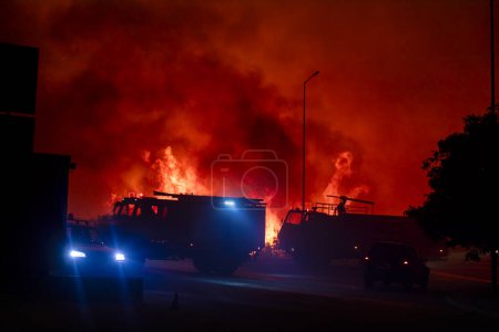 Photo for Alexandroupoli - Greece, August 21, 2023: The silhouette of a firetruck. Forest fires in the prefecture of Evros in northern Greece in the biggest fire ever in Europe - Royalty Free Image