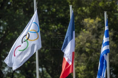Photo for Olympia, Greece - April 15, 2024: Final dress rehearsal of the Olympic flame lighting ceremony for the Paris 2024 Summer Olympic Games in Ancient Olympia, Greece. Olympic flag with French and Greek flags - Royalty Free Image