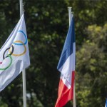 Olympia, Greece - April 15, 2024: Final dress rehearsal of the Olympic flame lighting ceremony for the Paris 2024 Summer Olympic Games in Ancient Olympia, Greece. Olympic flag with French and Greek flags